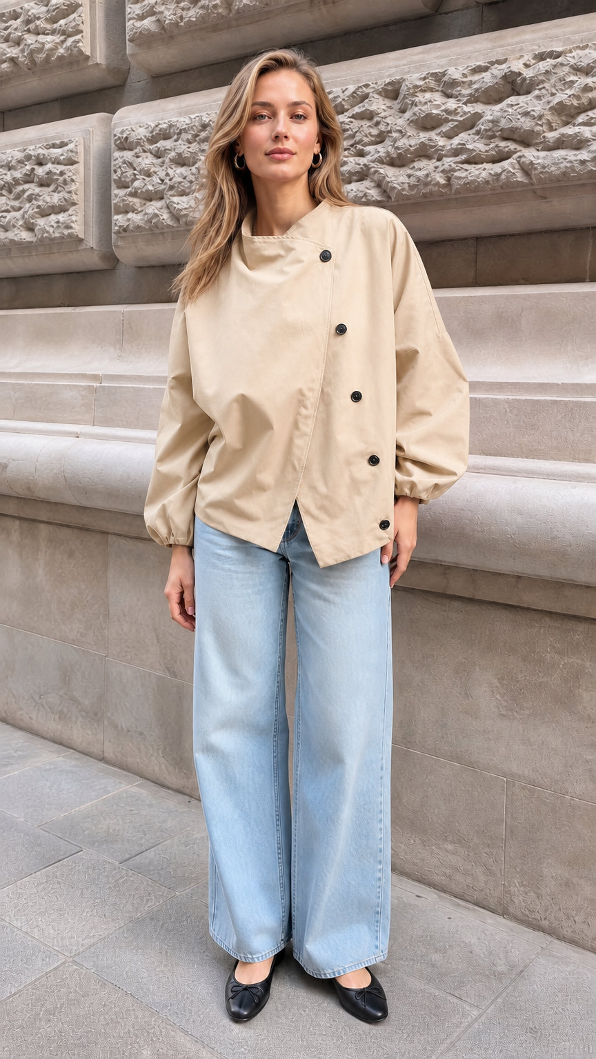 Model wearing the beige neutral asymmetrical button blouse