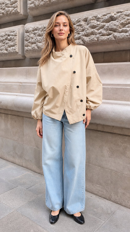 Model wearing the beige neutral asymmetrical button blouse