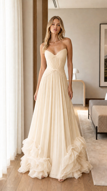 Model wearing Champagne ivory strapless sweetheart pleated tulle evening gown