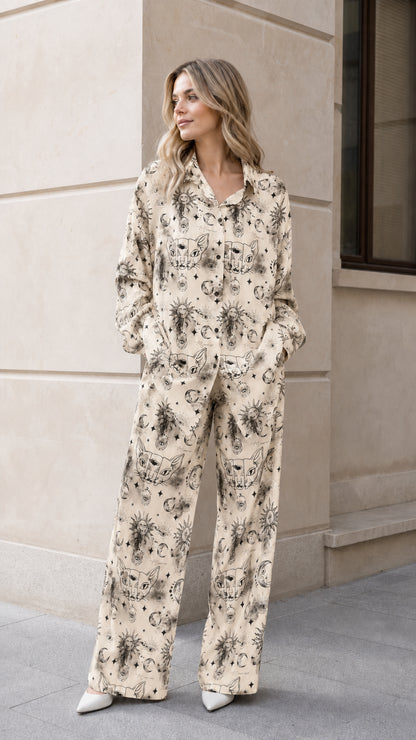 Woman wearing beige celestial sun and moon print pajama set