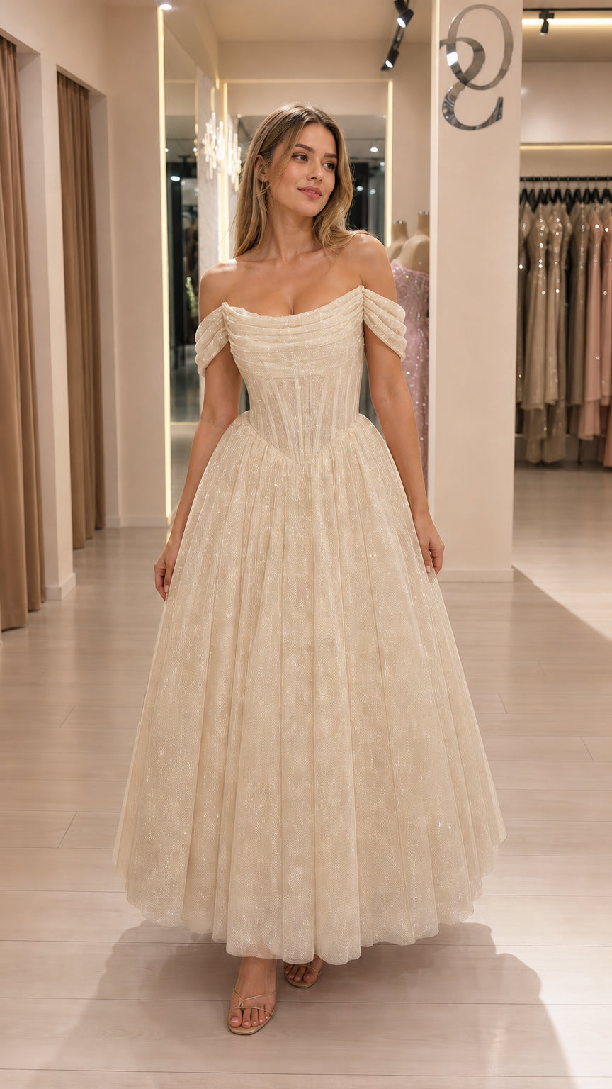 Model wearing champagne glitter tulle corset midi dress