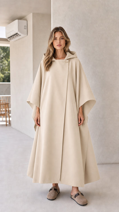 Model wearing beige cream longline hooded cape coat