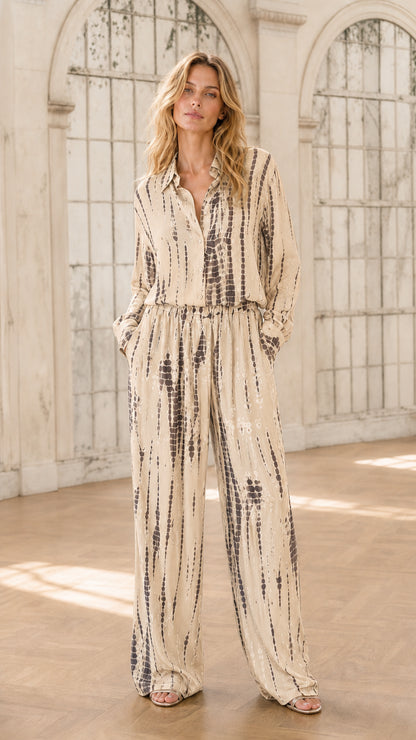 Model wearing beige tie-dye jumpsuit