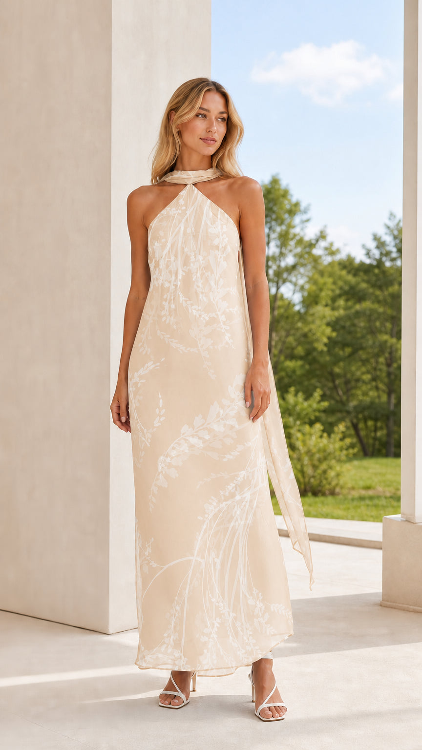Full length view of model in champagne floral halter maxi dress