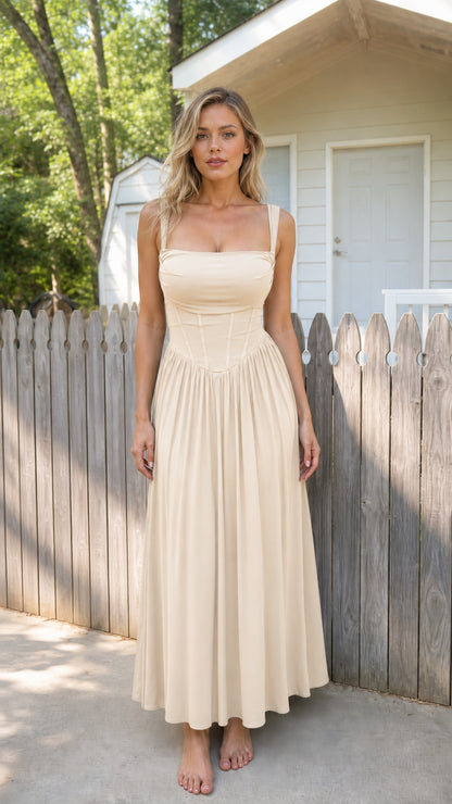 Front view of woman wearing beige corset cami maxi dress
