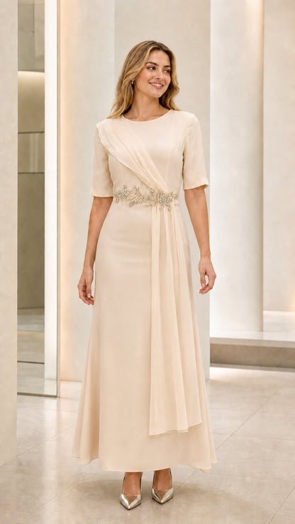 Front view of model wearing champagne cream elegant short sleeve evening maxi gown