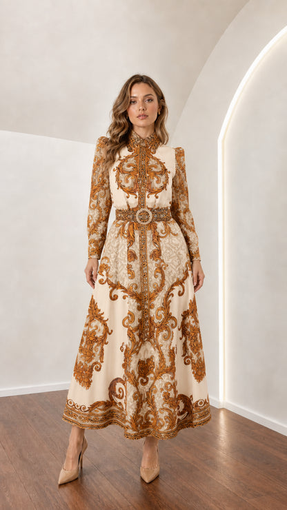 Model wearing cream champagne gold ornate scroll pattern belted maxi dress