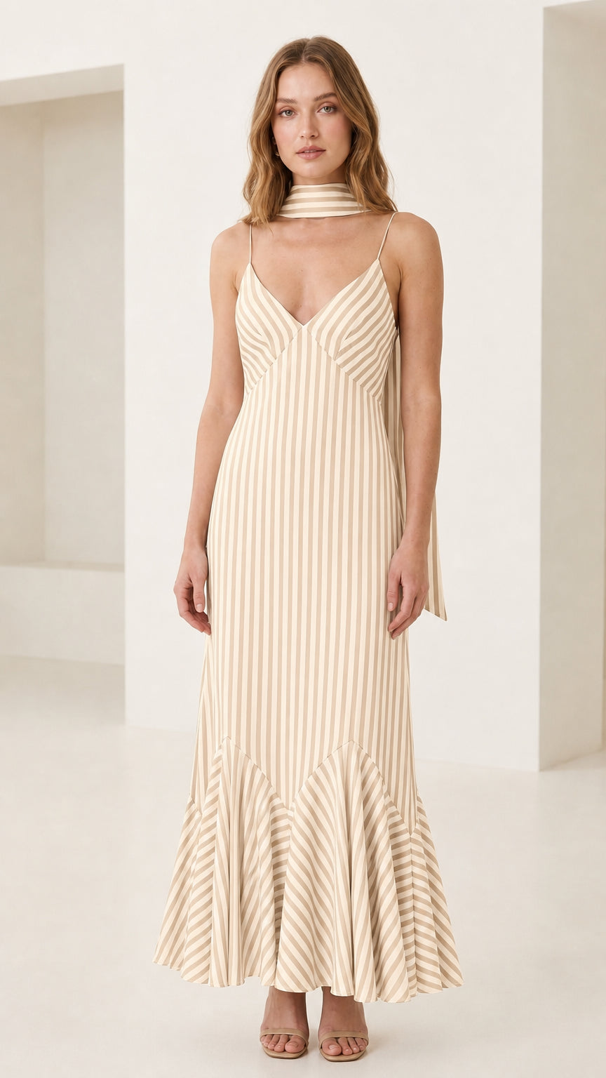Front view of model in cream striped cami maxi dress