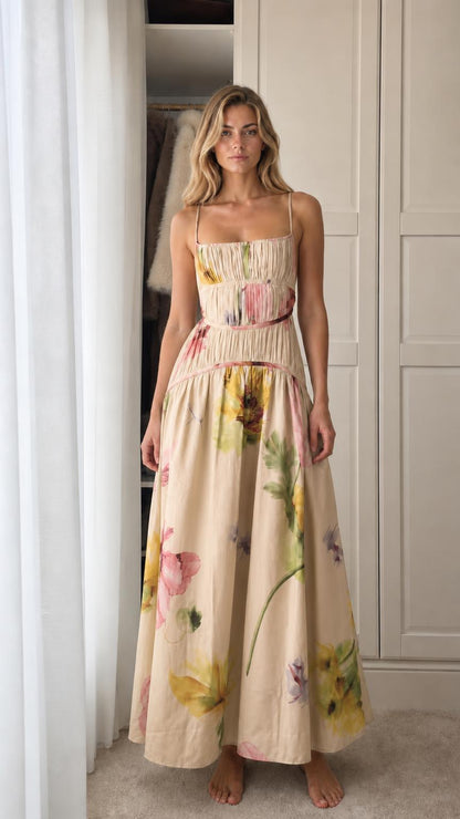 Model wearing beige floral print smocked maxi dress