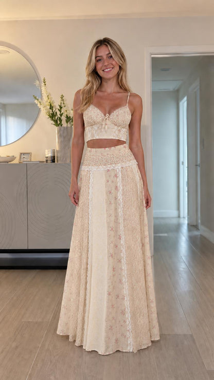 Model wearing cream tonal floral patchwork two-piece set