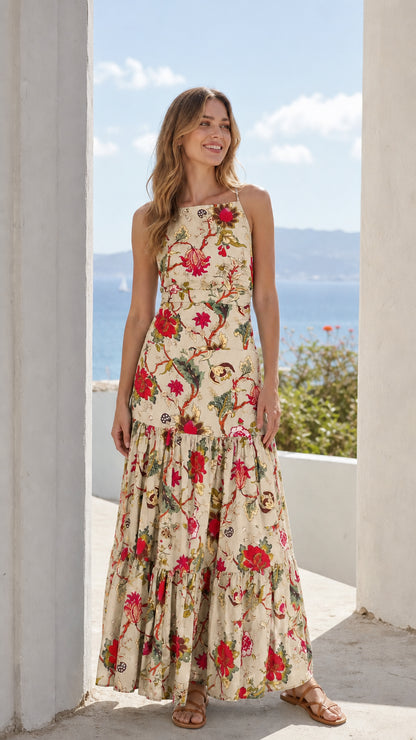 Woman wearing beige floral tiered maxi dress