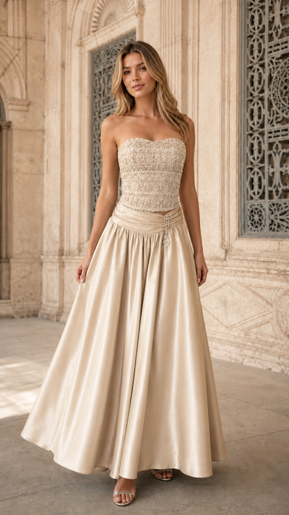 Model wearing champagne gold strapless embellished formal evening dress