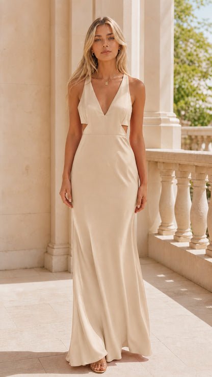 Front view of model wearing champagne beige backless cutout evening dress