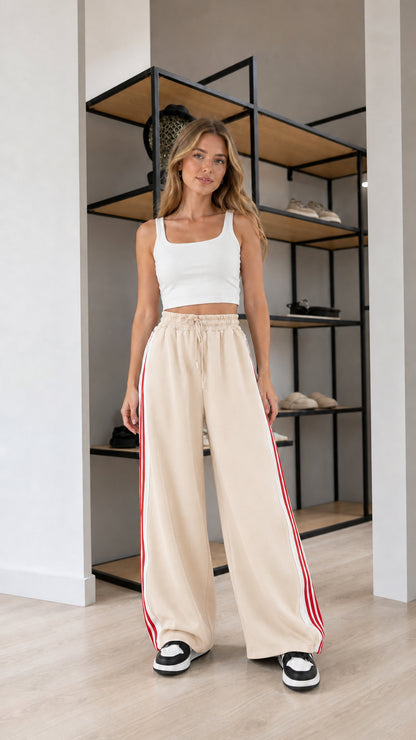 Front view of model wearing Beige wide leg striped sweatpants