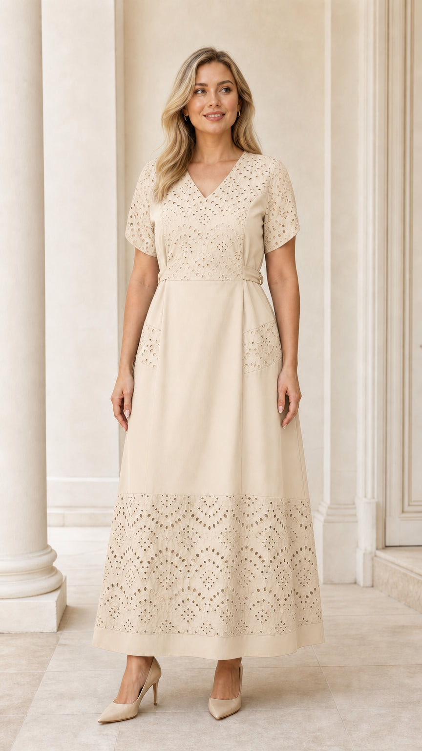 Full-length view of woman wearing cream beige eyelet embroidered belted maxi dress