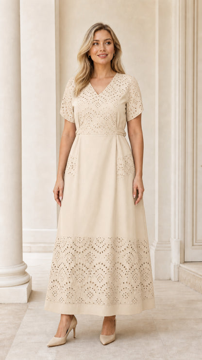Full-length view of woman wearing cream beige eyelet embroidered belted maxi dress