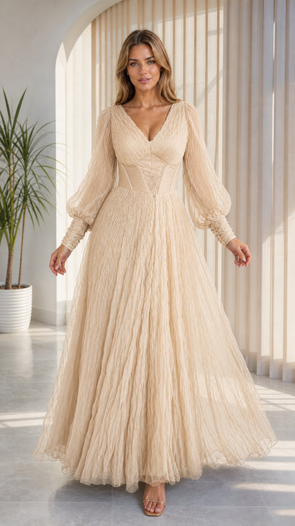 Front view of model wearing champagne cream layered tulle evening maxi dress