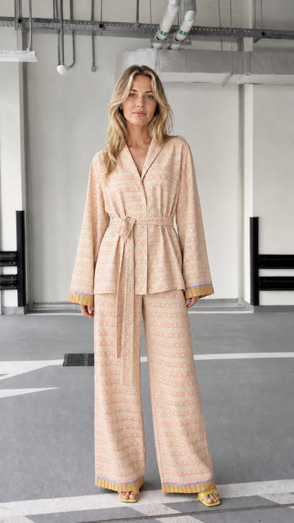 Woman wearing beige patterned two-piece lounge set