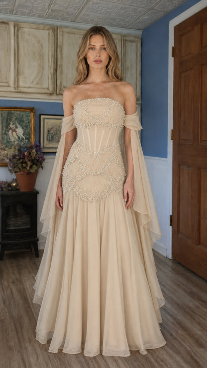 Front view of champagne beige beaded off-shoulder evening gown