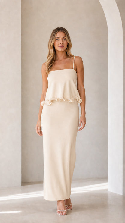 Model wearing cream sleeveless ruffle trim maxi camisole dress