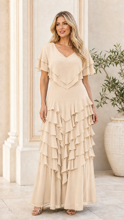 Model wearing champagne colored tiered ruffle dress