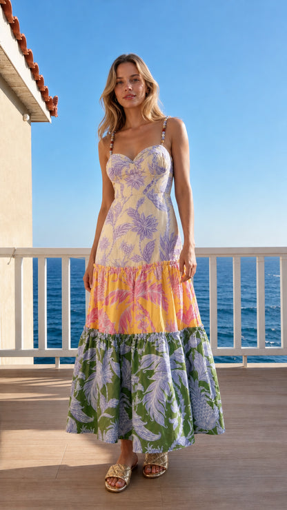 Model wearing yellow multi variant of tropical tiered maxi dress