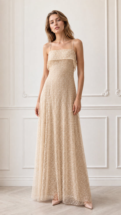 Model wearing champagne gold sequin embroidered formal maxi gown