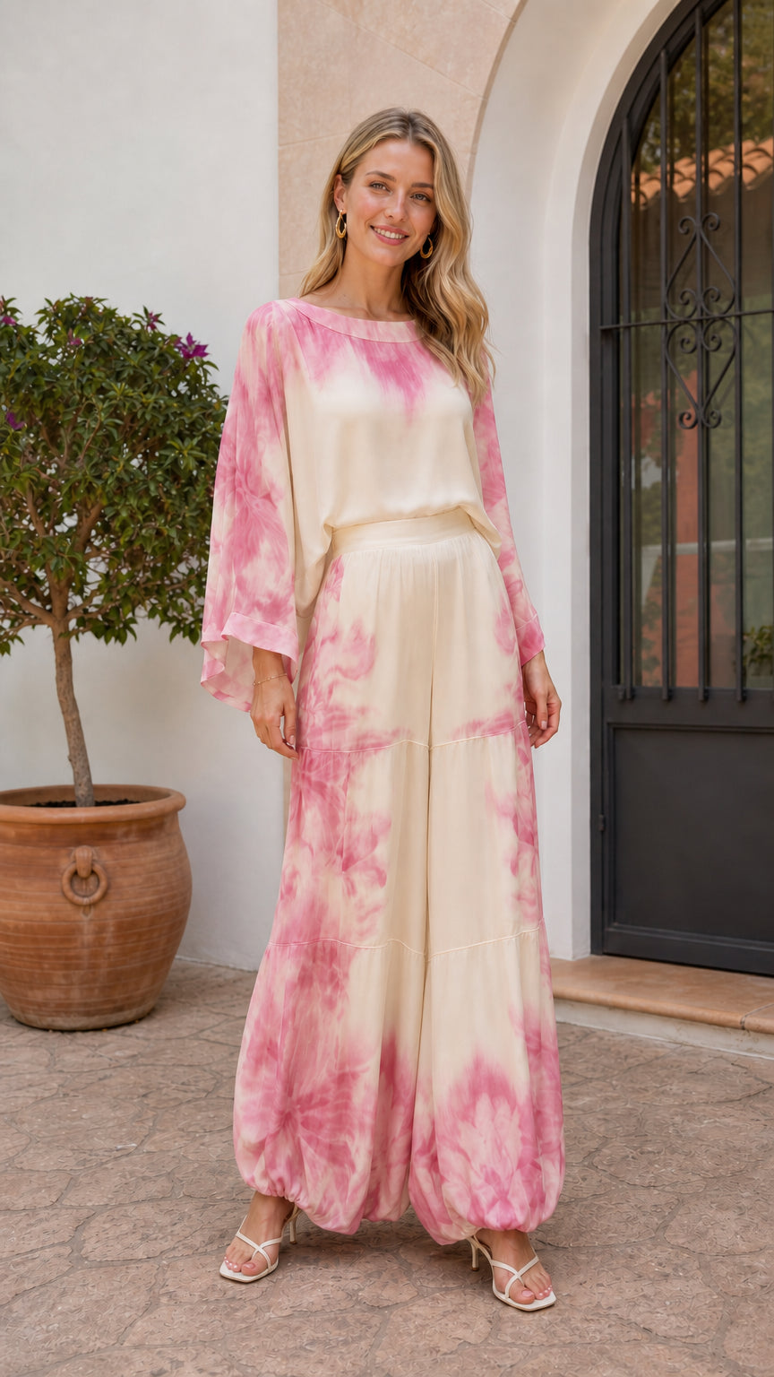 Model wearing rose pink tie-dye two-piece set