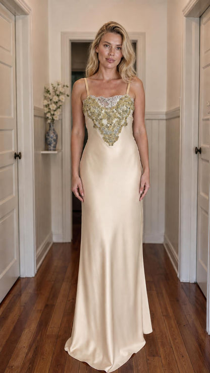 Front view of model wearing champagne satin maxi slip dress