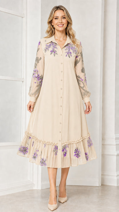 Front view of woman wearing beige floral embroidered midi dress