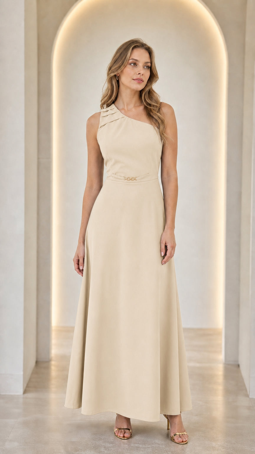 Woman wearing a beige one-shoulder pleated maxi dress