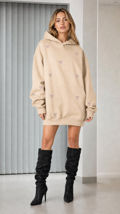 Full-length view of beige rhinestone bow oversized hoodie dress