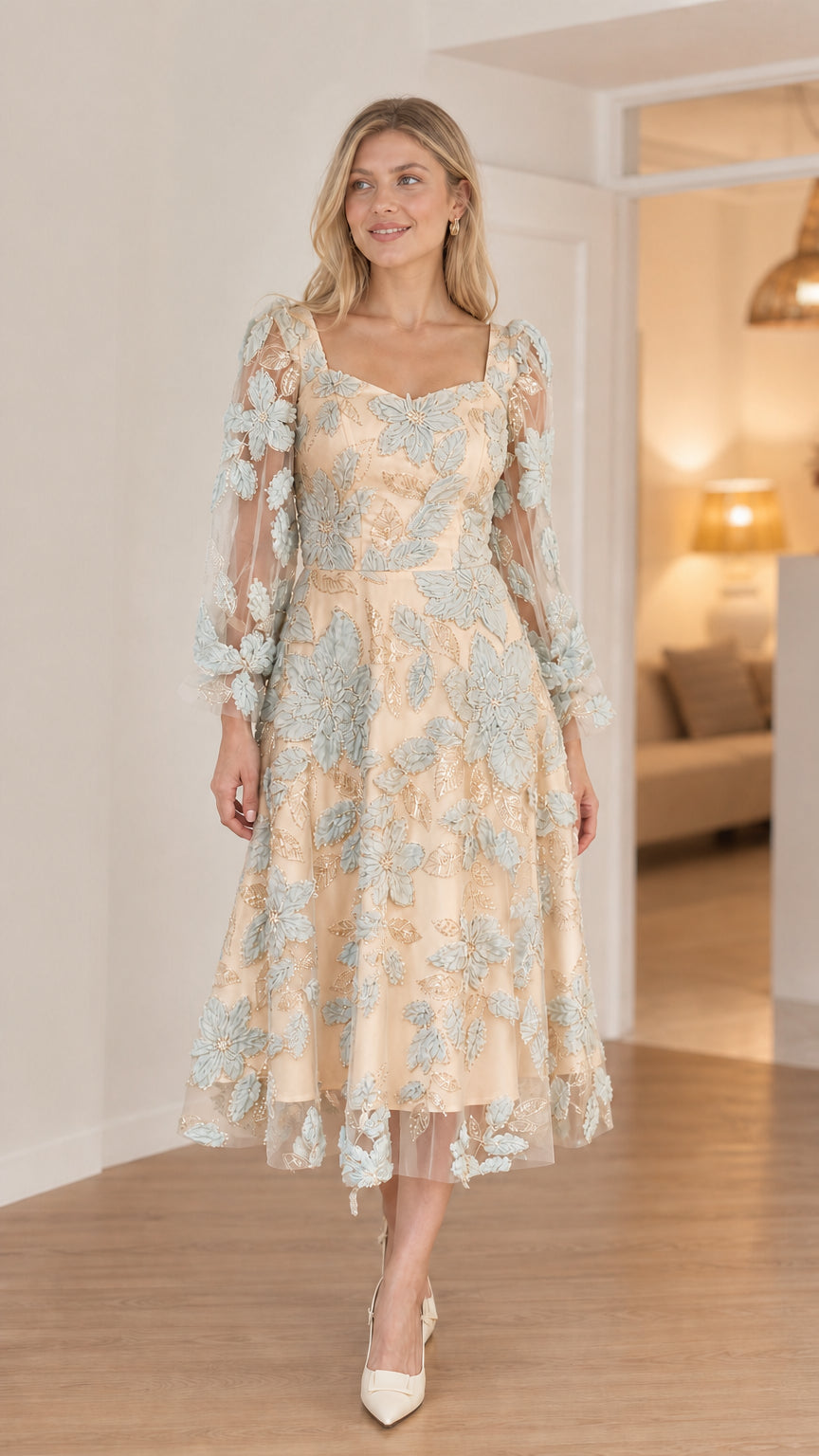 Front view of model in champagne floral applique midi dress