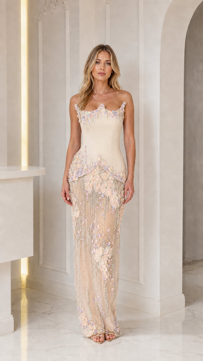 Front view of champagne embellished strapless gown