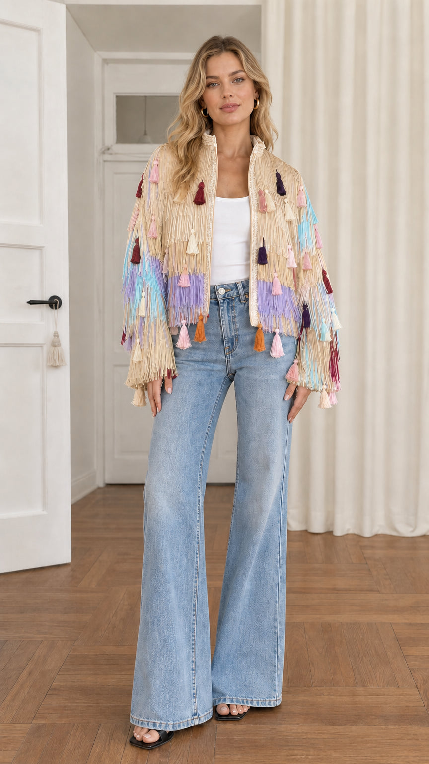Full-length shot of model wearing beige champagne multi fringe tassel jacket