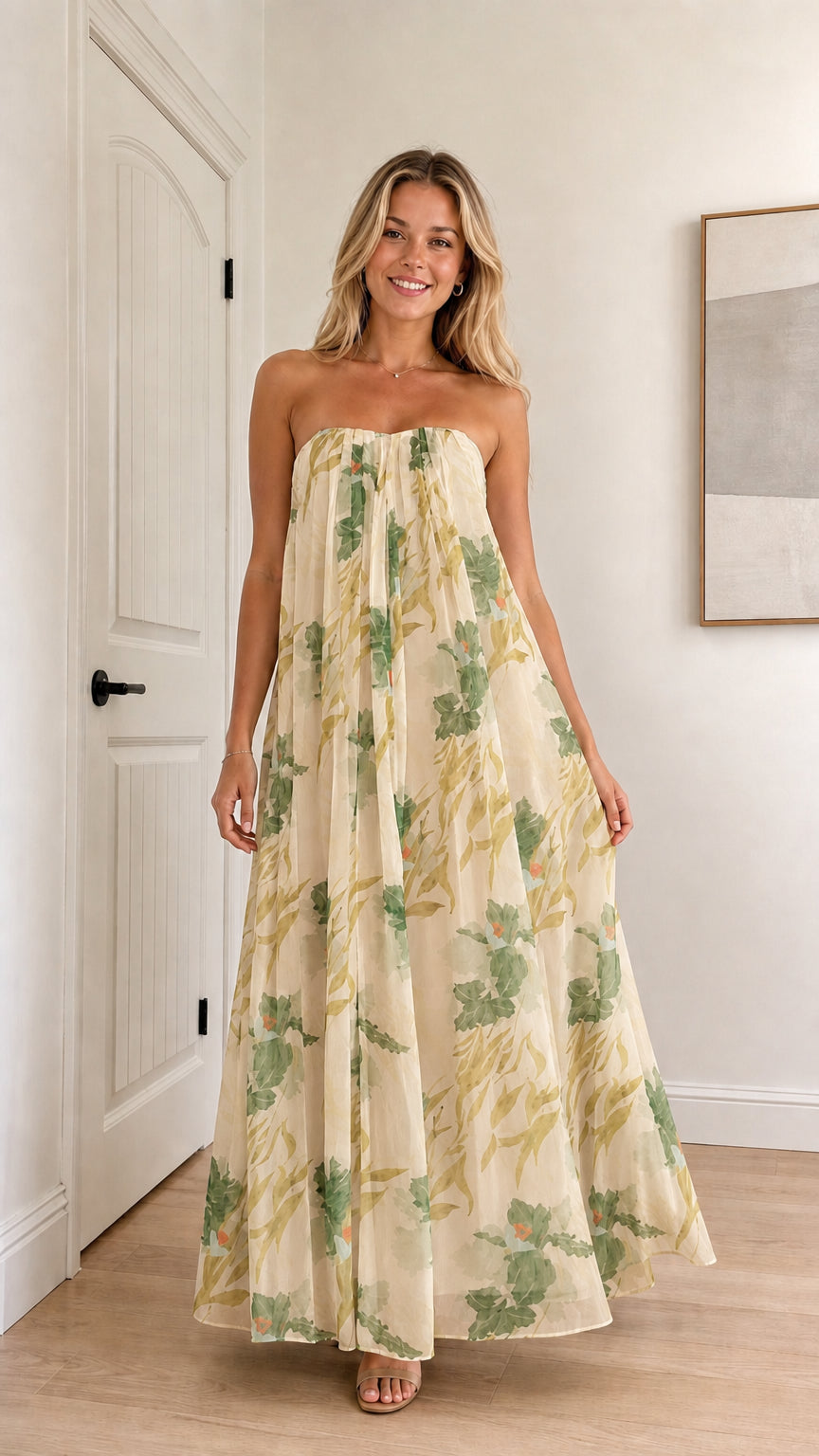 Model wearing champagne floral strapless maxi dress