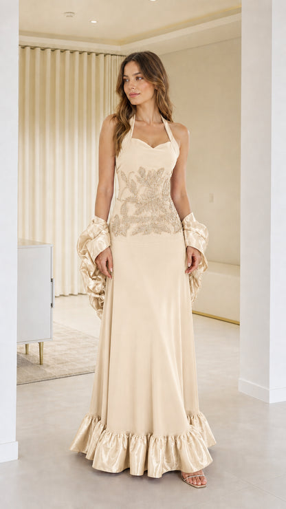 Front view of woman wearing beige halter neck evening dress