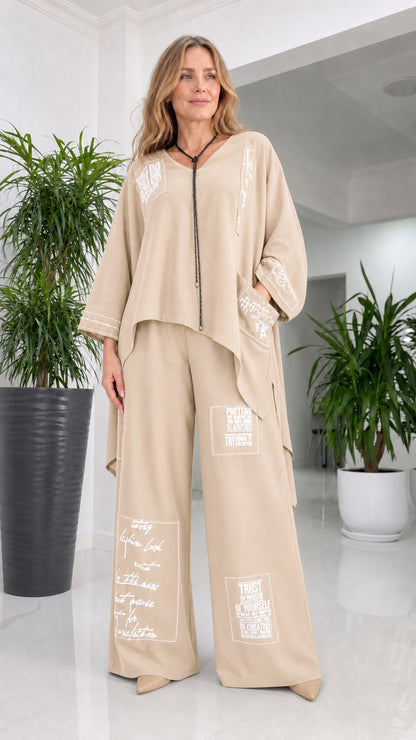Front view of woman wearing beige pant set