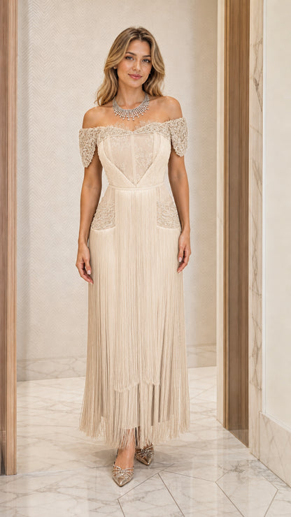 Front view of champagne cream off-the-shoulder fringe evening gown