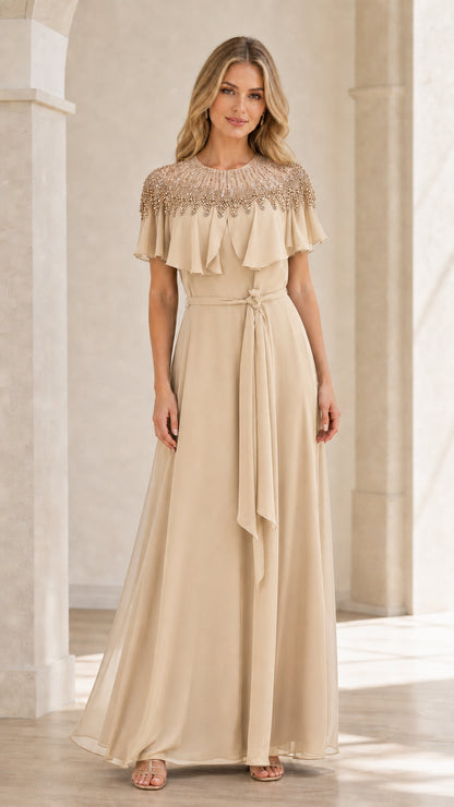 Front view of champagne beaded capelet maxi dress