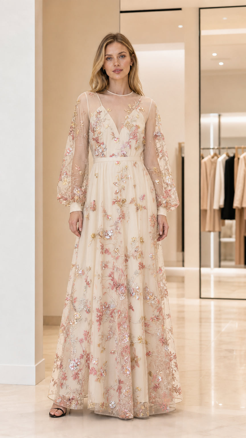 Front view of woman wearing champagne embroidered maxi dress