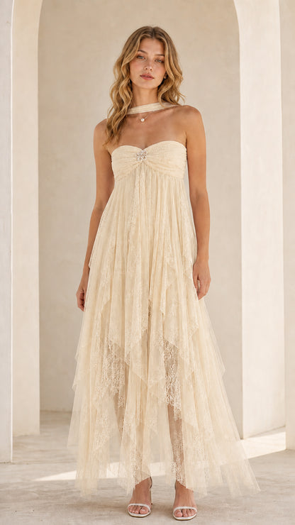 Model wearing cream strapless tulle maxi dress