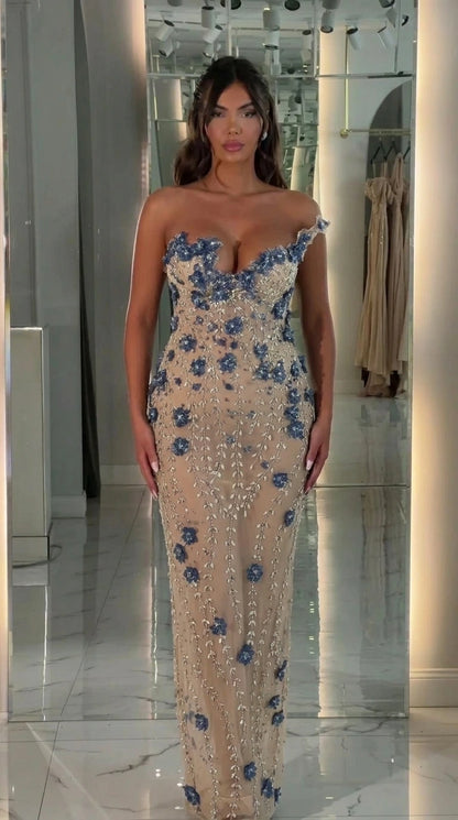Front view of champagne beaded strapless evening gown