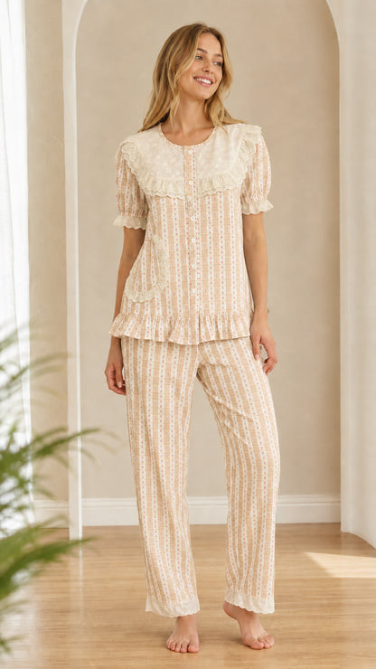 Model wearing neutral beige oatmeal gingham pajama set with eyelet lace detail