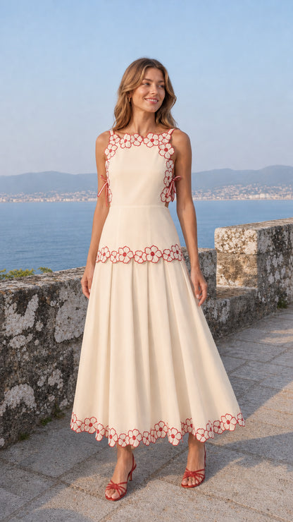 Woman wearing beige variant of the embroidered floral midi dress