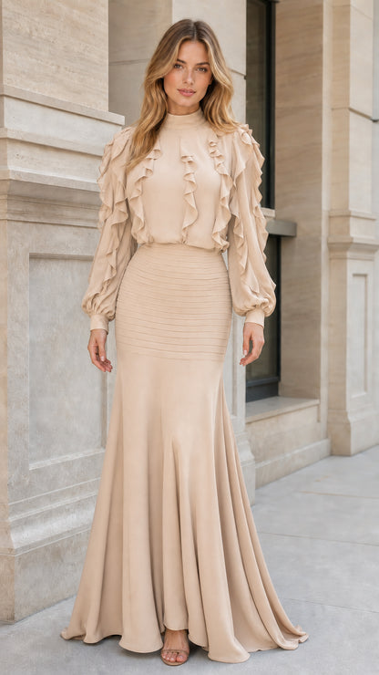 Front view of woman wearing beige ruffled long sleeve maxi dress
