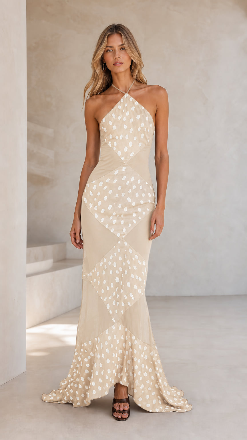Front view of champagne beige halter polka dot maxi dress
