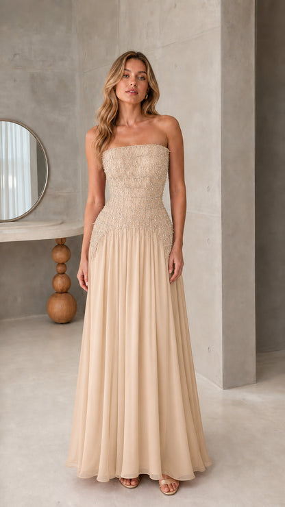 Front view of strapless champagne beige beaded corset formal maxi gown