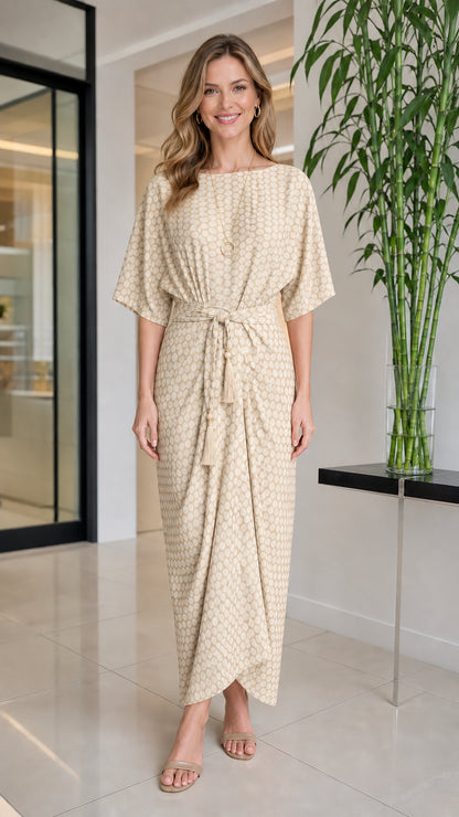 Front view of woman wearing beige geometric print maxi dress