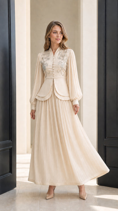 Front view of champagne beaded long sleeve maxi dress